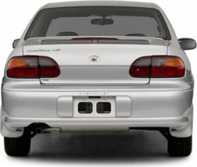 Rear view of mid-90s sedan with distinct tail lights and rear spoiler