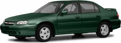 Side view of green mid-size sedan with smooth rounded edges and classic styling