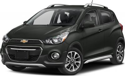 Compact hatchback with prominent headlights and roof rails front view