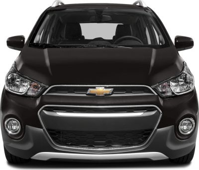Front view featuring grille, headlights, fog lights, and roof rails.