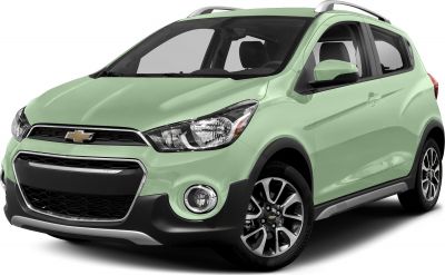 Front side view of compact car with headlights, grille, fog lights, and roof rails