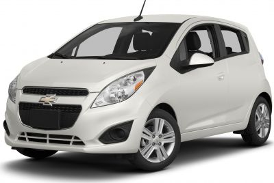Front and side view of a white compact hatchback with detailed headlights and grille
