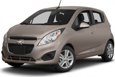 Front and side perspective of a compact hatchback with prominent headlights and alloy wheels