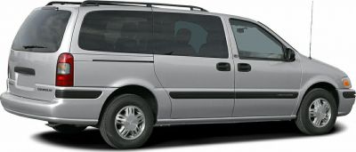 Side view of a minivan with sliding doors and rear design
