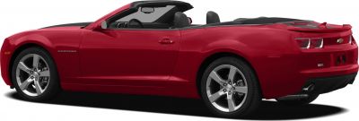 Red convertible with sporty side profile and alloy wheels