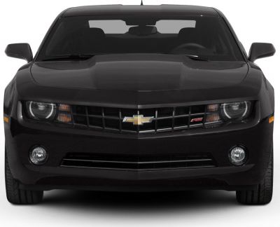 Aggressive front grille and headlights of a muscle car.