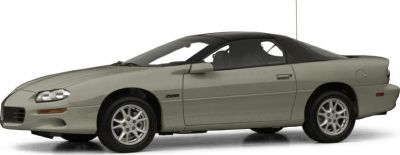 Side profile of a sleek sports coupe with T-top roof and alloy wheels
