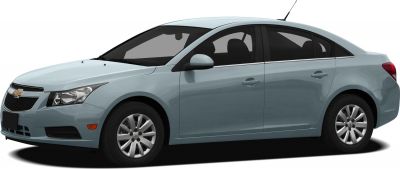 Front side view of sedan with alloy wheels and distinct headlight design.