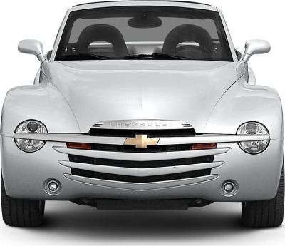 Front close-up view with rounded headlights and chromed grille