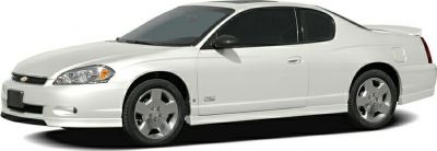 White coupe with tinted windows, alloy wheels, and rear spoiler