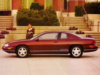 Sleek side profile of a two-door classic coupe with alloy wheels