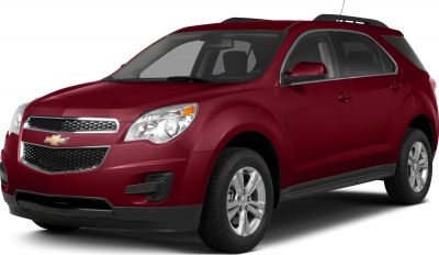 Front-side view of a red SUV with alloy wheels and distinctive grille