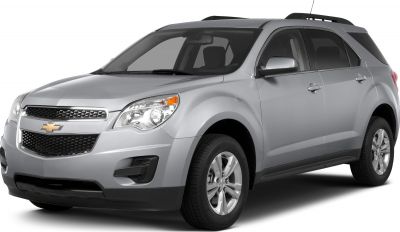 Front side view of silver SUV with alloy wheels and roof rails