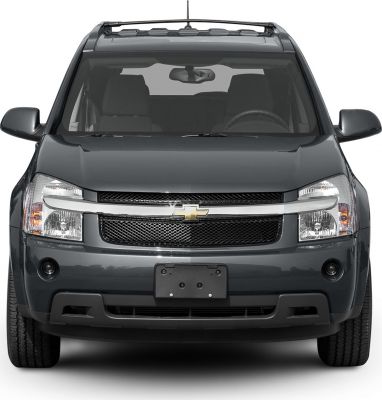 Front view with grille, headlights, and roof rack