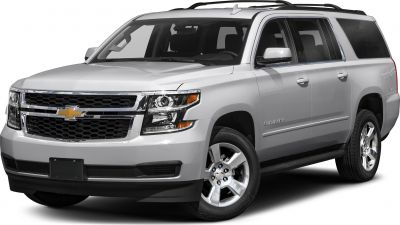Front side view with chrome grille and roof rack