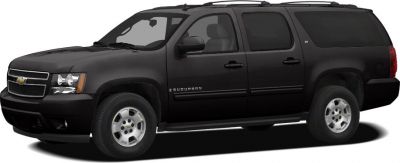 Full-size black SUV with roof rails, side steps, and alloy wheels