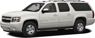 White full-size SUV with four doors and roof rack side view