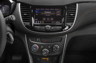 Infotainment screen and climate control knobs on a car dashboard