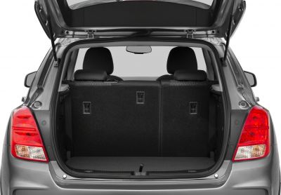 Open rear cargo area with back seats and hatch open