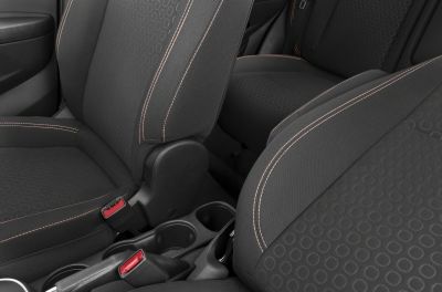 Fabric car seats with circular pattern and contrast stitching