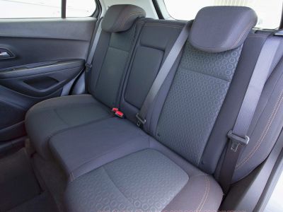 Rear seat with patterned fabric, headrests, and seat belts