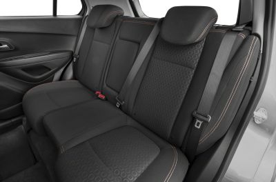 Rear seat with black patterned upholstery and seat belts