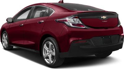 Rear view of red five-door hatchback with clear taillights and alloy wheels