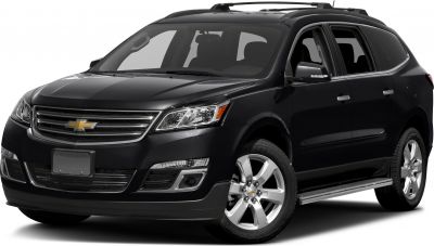Front three-quarter view of black SUV with headlights and alloy wheels