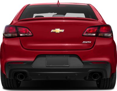 Rear view with dual exhaust, taillights, and rear spoiler