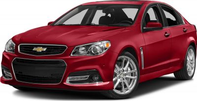 Front grille and headlight closeup of a red sporty sedan