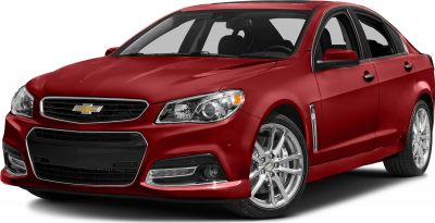 Front grille and alloy wheels of a red sedan