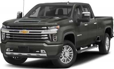 Heavy-duty pickup with crew cab and long bed, prominent grille and hood scoop