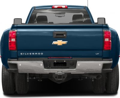 Rear view featuring tailgate, dual rear tires, and bumper of a heavy duty pickup truck
