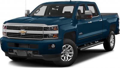 Front and side view of a heavy duty pickup with chrome grille and running boards