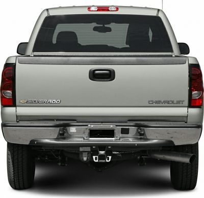 Rear view of pickup truck tailgate with tow hitch and exhaust