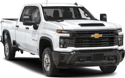 Heavy-duty pickup with crew cab and long bed in white, featuring robust grille and modern design elements