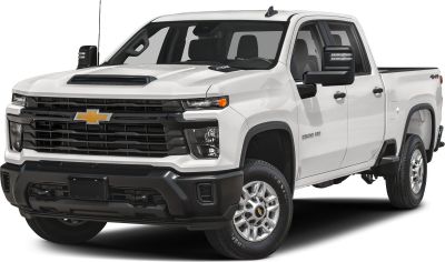 Heavy-duty pickup with double cab, long bed, bold grille, and hood scoop