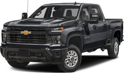 Heavy duty pickup with aggressive front grille, dual headlights, and long bed