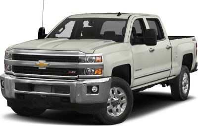 Heavy duty pickup truck with double cab and standard cargo bed front view.