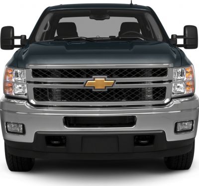 Front view with large grille, dual headlights, and extended side mirrors