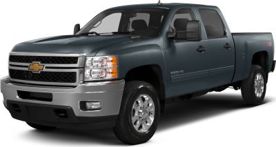 Front-side view of heavy-duty extended cab pickup with robust grill and headlights