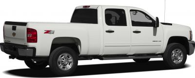 White extended cab pickup truck with standard box and 4x4 offroad badge