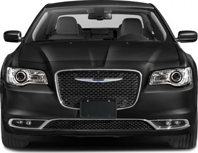 Front view with mesh grille and LED headlights of a luxury sedan