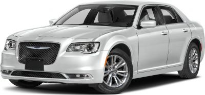Front-side view of a modern luxury sedan with distinctive grille and chrome wheels.