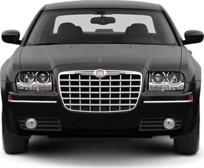 Front view with iconic grille and dual round headlights