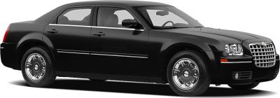 Chrome grille and classic wheel covers on a full-size sedan