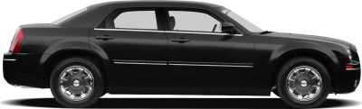 Side view of a sedan with chrome wheels and sleek door panels.
