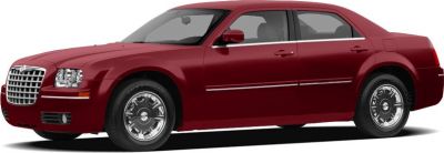 Red 4-door sedan with chrome wheels and classic design