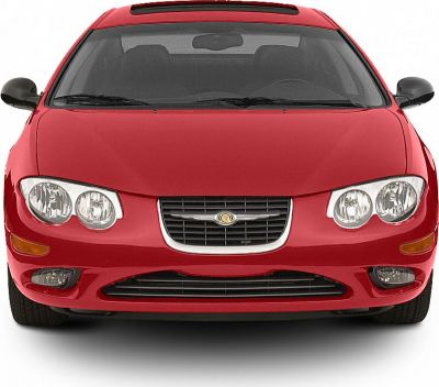 Front view with dual round headlights, chrome grille, and integrated fog lights