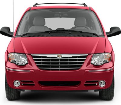 Front view with grille, headlights, fog lights, and roof rails.